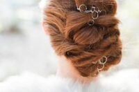 40 a beautiful and chic twisted low updo with a catchy hoop hair vine is a stylish and catchy idea for long hair, it feels like Vikings