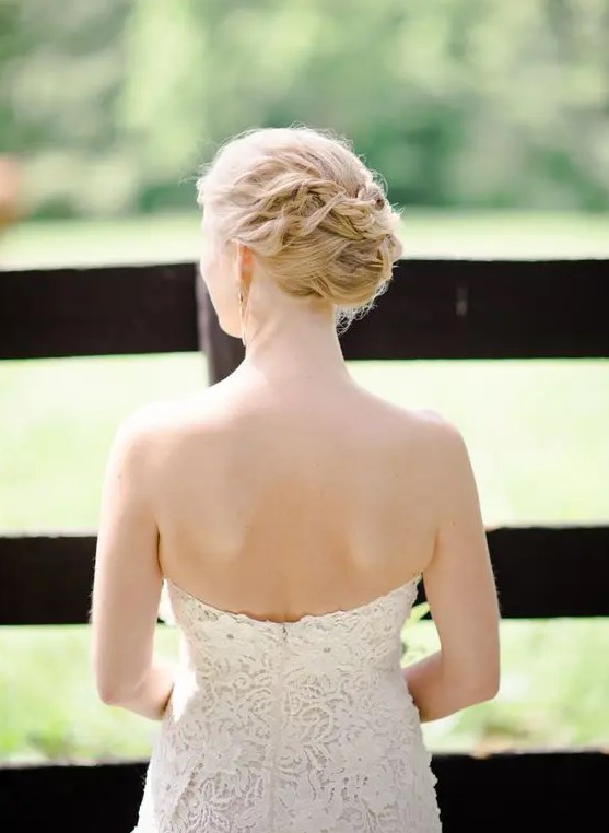 a braided and twisted wedding updo for a chic yet not old-fashioned look is a cool idea for medium and long hair