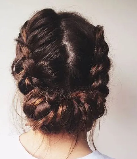 a cool braided low updo with a texture looks cool for a rustic or boho bride and will fit long hair