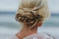 47 a cool low updo with a fishtail and twisted braid, some locks down and a crystal crown are a great combo for a beach bride
