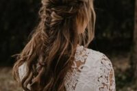 48 a cool boho half updo with a double braided halo and a fishtail braid and waves down is a cool idea for a boho bride