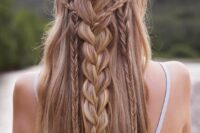 49 a braided half updo with several small and large braids down and long hair down is a chic and cool idea for a boho bride