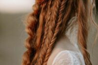 50 a bold boho ginger hairstyle with braids all over and a bump on top is a lovely idea for a boho bride