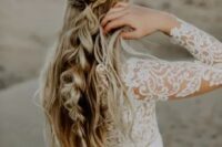 51 a boho half updo with braids and twists, with a large bubble braid and waves down is a beautiful and eye-catchy option