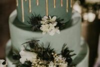 52 a sage green wedding cake with a marble tier, white blooms and thistles and a gold drip on top is a lovely and catchy idea