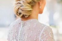 53 a low and loose twisted wedding updo with a volume on top is great for long hair and it can be rocked with many bridal styles