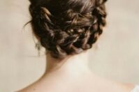 55 a twisted and braided low updo with a volume and texture on top for a boho or rustic bride
