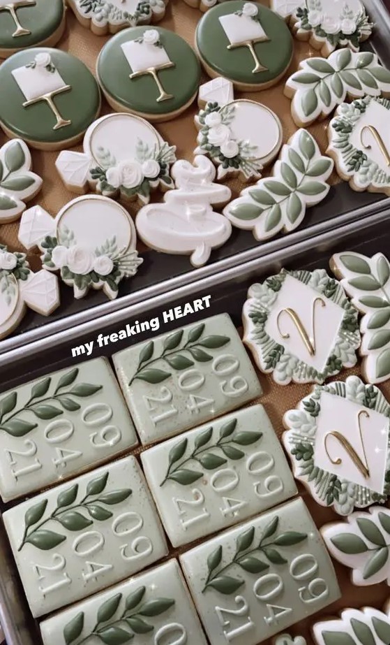 an assortment of beautiful green and white cookies is ideal for a sage and white wedding
