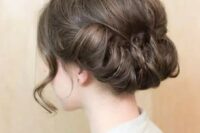 56 a low updo with a bump and a twisted bottom plus some locks down looks very refined and vintage-inspired