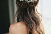 57 a beautiful half up hairstyle with a thick braided halo and a chic rhinestone floral hair vine is a lovely idea
