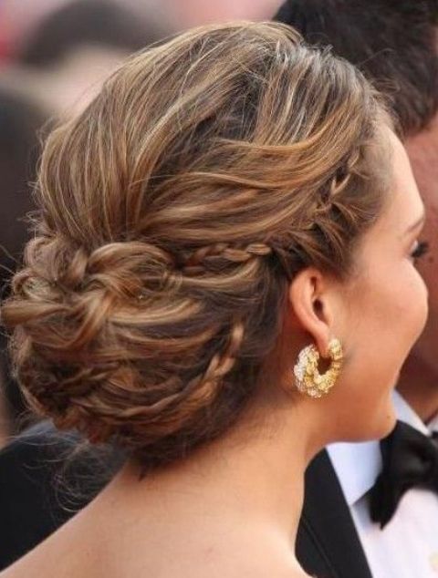an updo with a braided halo, a messy bump on top and a low bun is a cool idea for an elegant bridal look