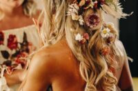 59 a boho wedding half updo with a double fishtail braid halo, waves down and a lot of dried blooms tucked in the hair