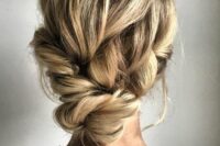 59 a lovely messy low updo with a twisted top and a twisted lower part for a non-formal bride