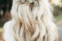 60 a boho wedding half updo with a volume on top, a braided part and waves down plus a pearl hairpiece and baby’s breath