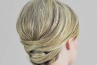 62 a sleek and twisted low updo with a bump on top is a stylish idea for medium length hair