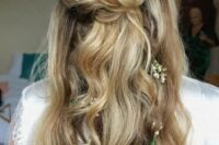 65 a fall boho wedding half updo with a twisted braided halo and a top knot, with waves down, a dried flower crown and more blooms in the hair
