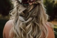 71 a lovely and classy half updo with a twisted halo and a loose braid and a bold fall flower crown is amazing