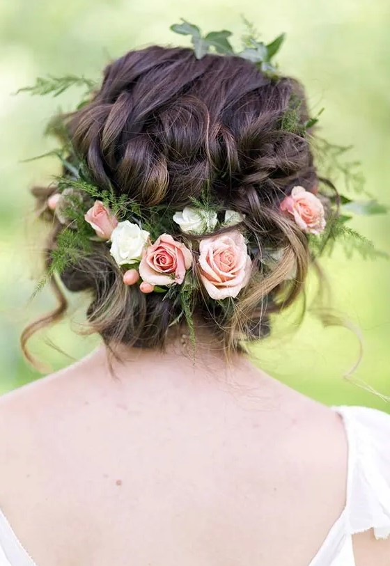 a messy braided updo with fresh roses, greenery and berries tucked in will be a great idea for a garden bride