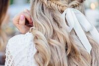 80 a wavy half updo with a fishtail braid secured with a white ribbon and a bow is a very relaxed boho idea