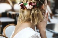 82 a wavy half updo with two braids secured with fresh flowers and greenery is a chic idea