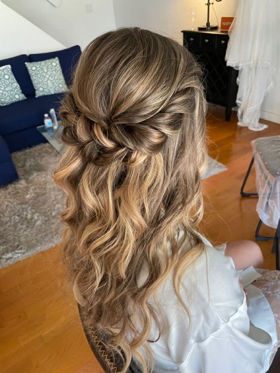 a beautiful long and wavy half updo with a bump on top and a twisted halo plus some waves down is amazing for a wedding