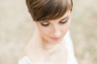 a brown straight pixie with caramel balayage and a rhinestone and pearl headband is a romantic and beautiful idea