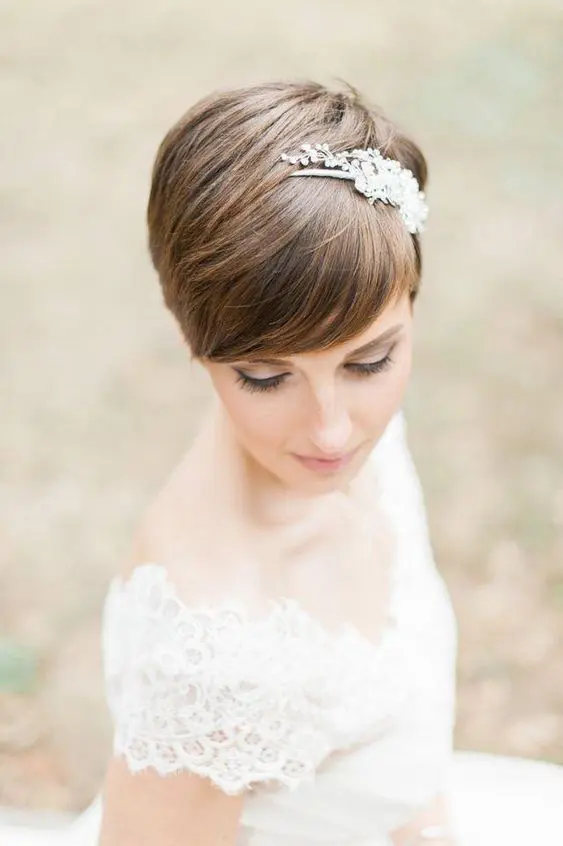a brown straight pixie with caramel balayage and a rhinestone and pearl headband is a romantic and beautiful idea