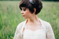 a dark brunette bixie haircut with waves is a very chic and cool idea for a wedding, accent it with rhinestones