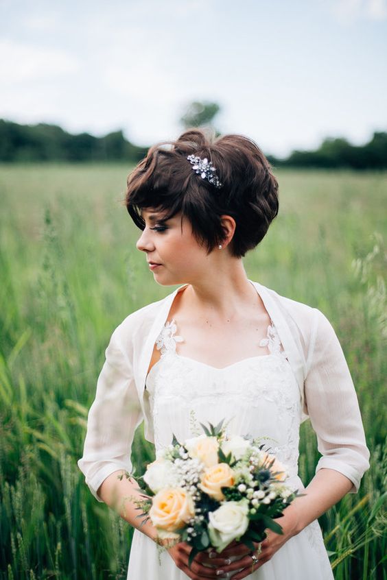 a dark brunette bixie haircut with waves is a very chic and cool idea for a wedding, accent it with rhinestones