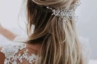 a fab and easy wedding half updo with a bump on top, with a twisted detail, long straight hair down and an embellished headpiece