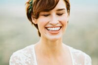 a ginger brown long pixie haircut with waves and a greenery touch is a chic and lovely idea for a wedding