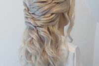 a gorgeous triple twist half updo with waves down and face-framing locks is a cool wedding hairstyle to rock