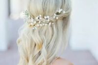 a half up with a twist and baby’s breath in it, some waves for a romantic look at a boho beach wedding or some other boho wedding