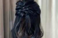 a half updo with twisted halos and a bump on top and some waves down is a cool idea for medium length hair