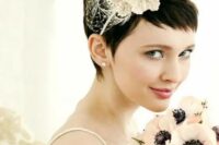 a long pixie haircut styled for the wedding with a headband with lace flowers and a tiny veil is a stylish and chic idea for a modern bride