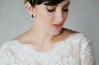 a pixie hairstyle with a fresh floral and greenery headband plus sapphire earrings for a statement