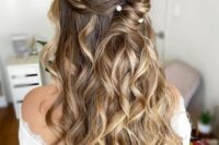 a lovely hairstyle with pearl accessories
