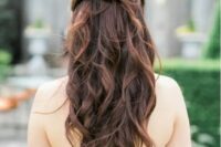 a twisted and wavy half updo will fit many bridal looks, from boho to rustic