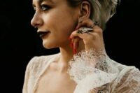 an ashy blonde long pixie haircut with a pearl headband are a super cool and refined combo for a wedding, it looks amazing