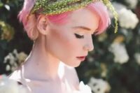 bright pink hair with greenery plus a blush wedding dress is a refined idea for a non-typical bridal look