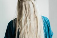 long textured hair with a double twisted halo and a bump on top is a chic and cool idea for a wedding