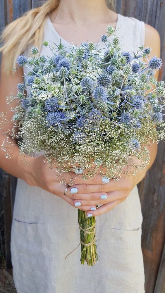 a cool wedding bouquet of thistles and some white fillers is a lovely idea for a wildflower or summer boho bride