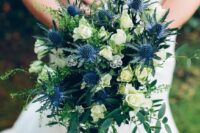 05 a lovely wedding bouquet of white roses, thistles, greenery and herbs is a cool idea for a summer wedding, it’s classics