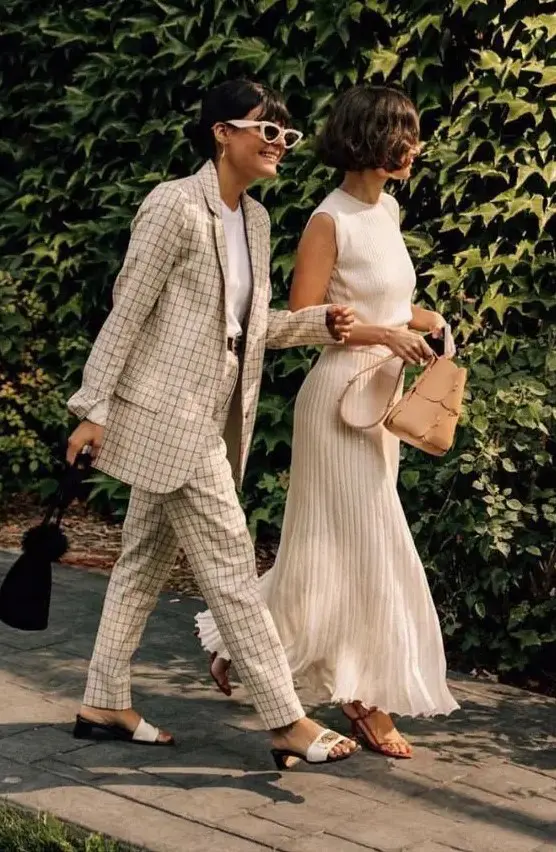 a neutral windowpane pantsuit, a white t-shirt and white mules are a great combo for a spring or summer wedding guest