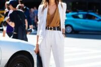 08 a pure white pantsuit with an oversized blazer, teal heels, a teal bag, a camel draped top