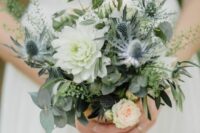 a small wedding bouquet with lots of greenery
