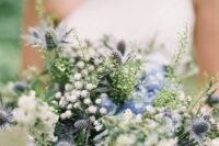 09 a super textural wedding bouquet of white blooms, blue thistles, greenery and other fillers is a lovely idea for a greenery-filled wedding