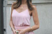 10 a pink spaghetti strap top, a color block pink and white pleated midi skirt and a tiny metallic clutch