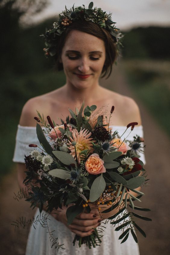 a bold fall wedding with peachy roses and dahlias, deep purple blooms, greenery, thistles and berries is a lovely solution