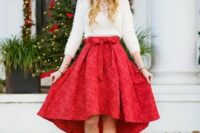 12 a red high low printed skirt with a bow, a white sweater and a statement necklace with silver shoes
